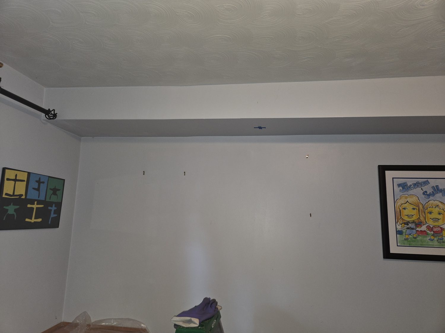 Pristine bedroom wall in a Central PA home with no visible signs of a honey bee colony living inside