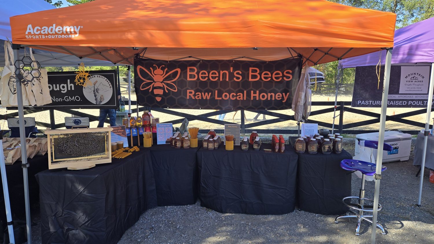 Been's Bees vendor tent at a local Central PA event with the Raw Local Honey banner and full product spread